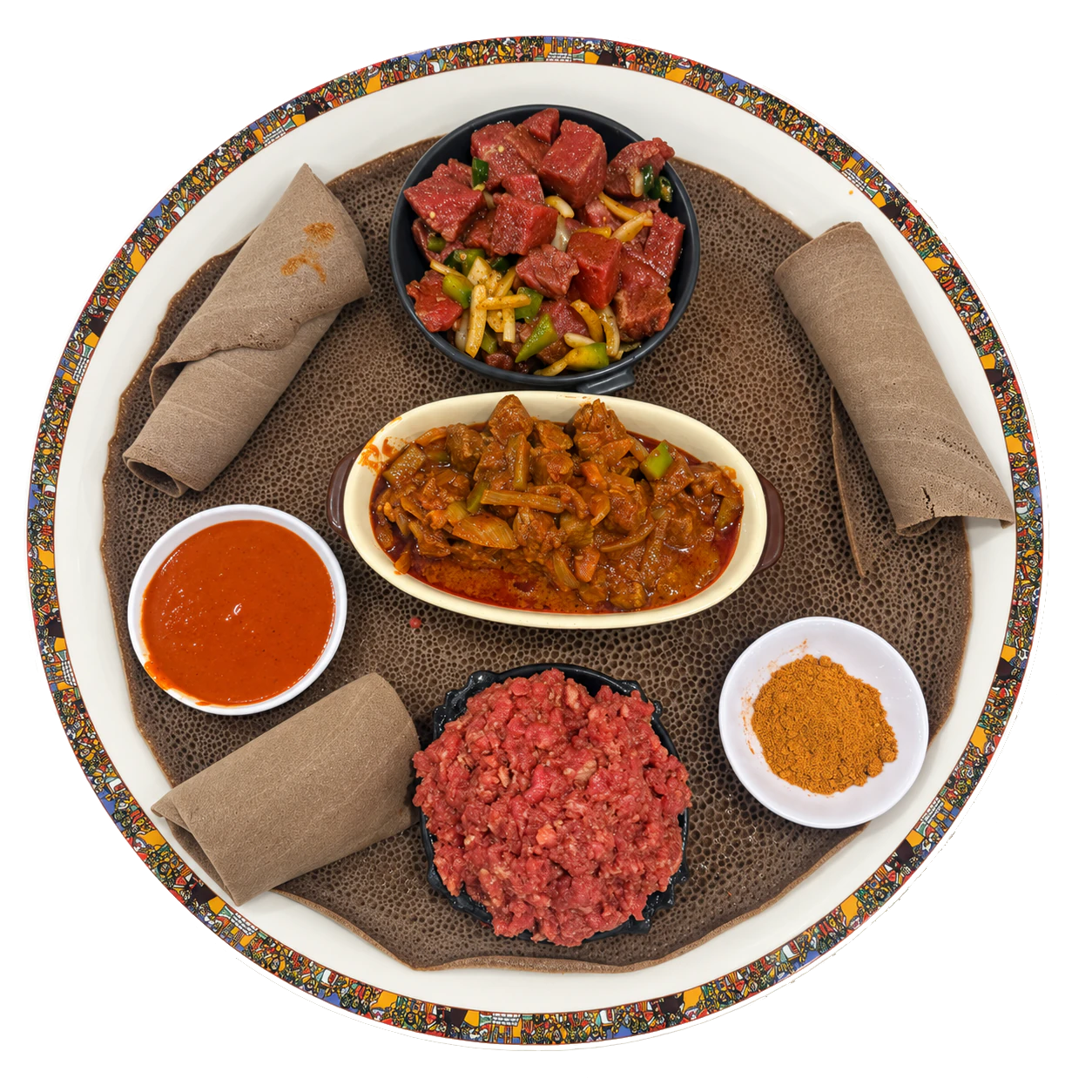 A selection of meat dishes, sauces and injera on a patterned serving plate.