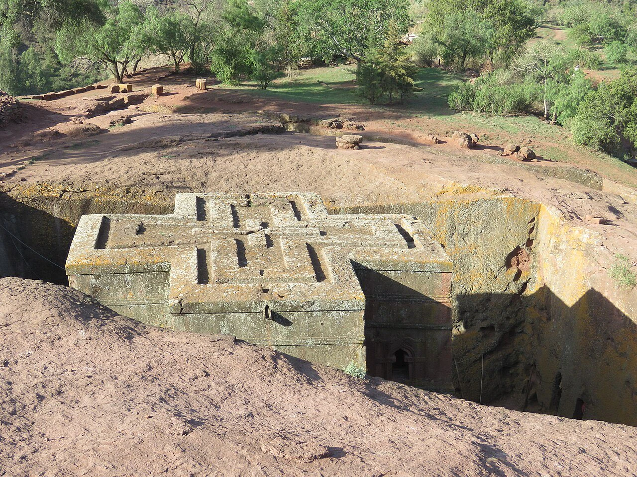 The cross-shaped roof of Bete Giyorgis, the Church of Saint George, within its rock-cut courtyard in Lalibela